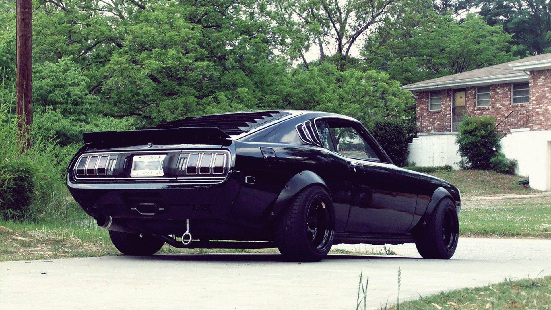 black classic car on driveway