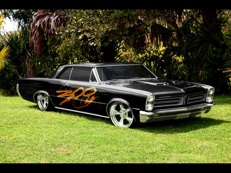 Black classic car on grass
