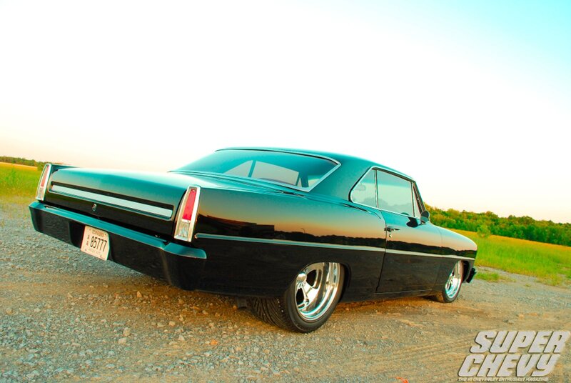Black classic car on gravel