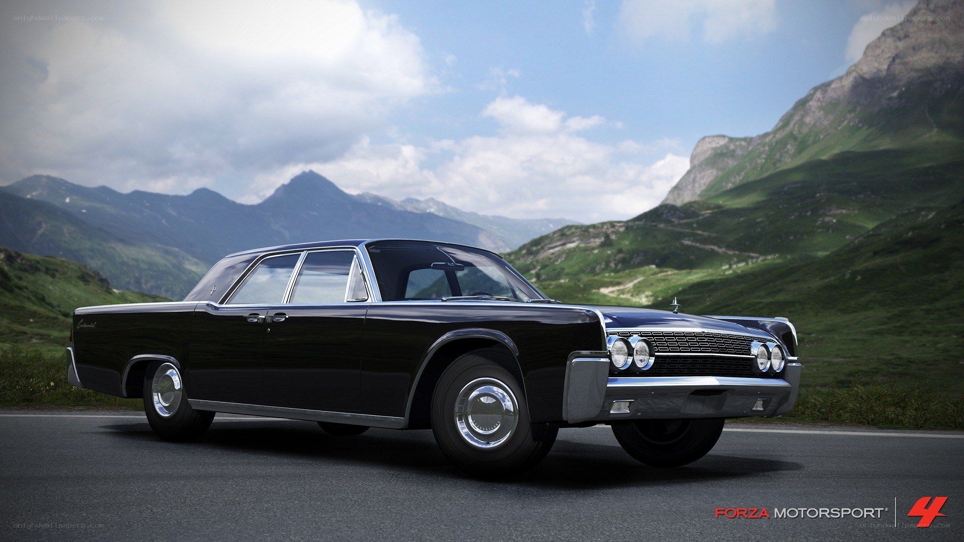 Black classic car on mountain road