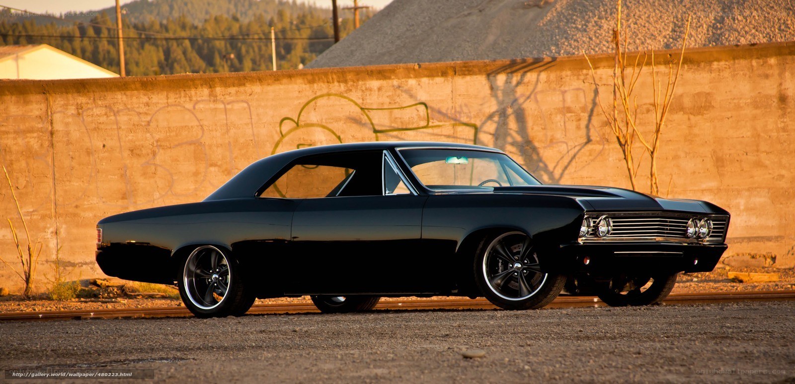 black classic car on tracks