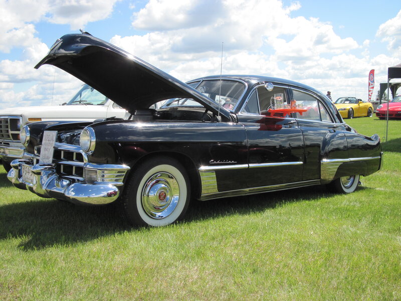 Black Classic Car — Outdoor, Afternoon, Photograph, Car Show, Grass Field, Other Cars, Cloudy Sky