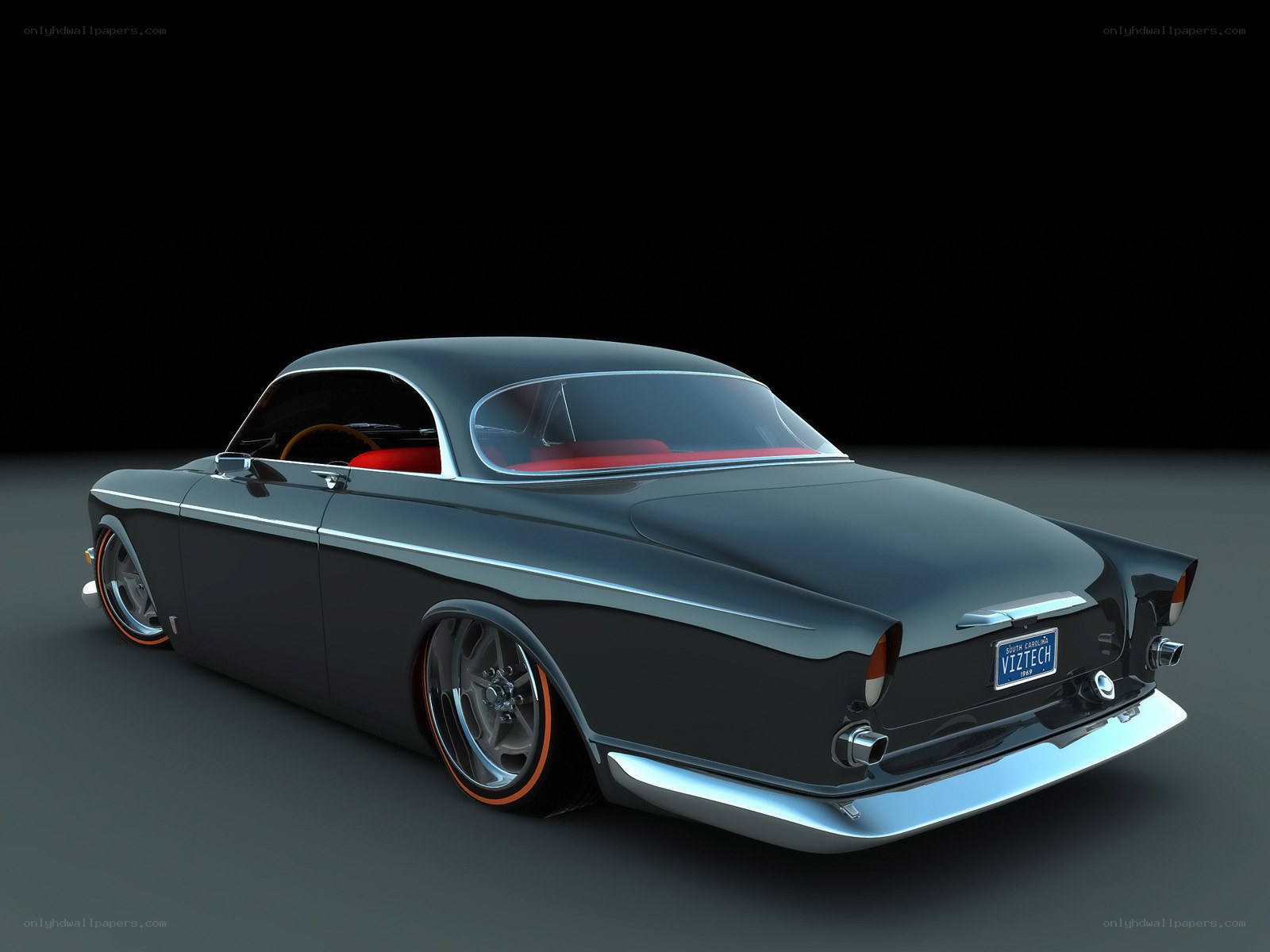 black classic car with red interior