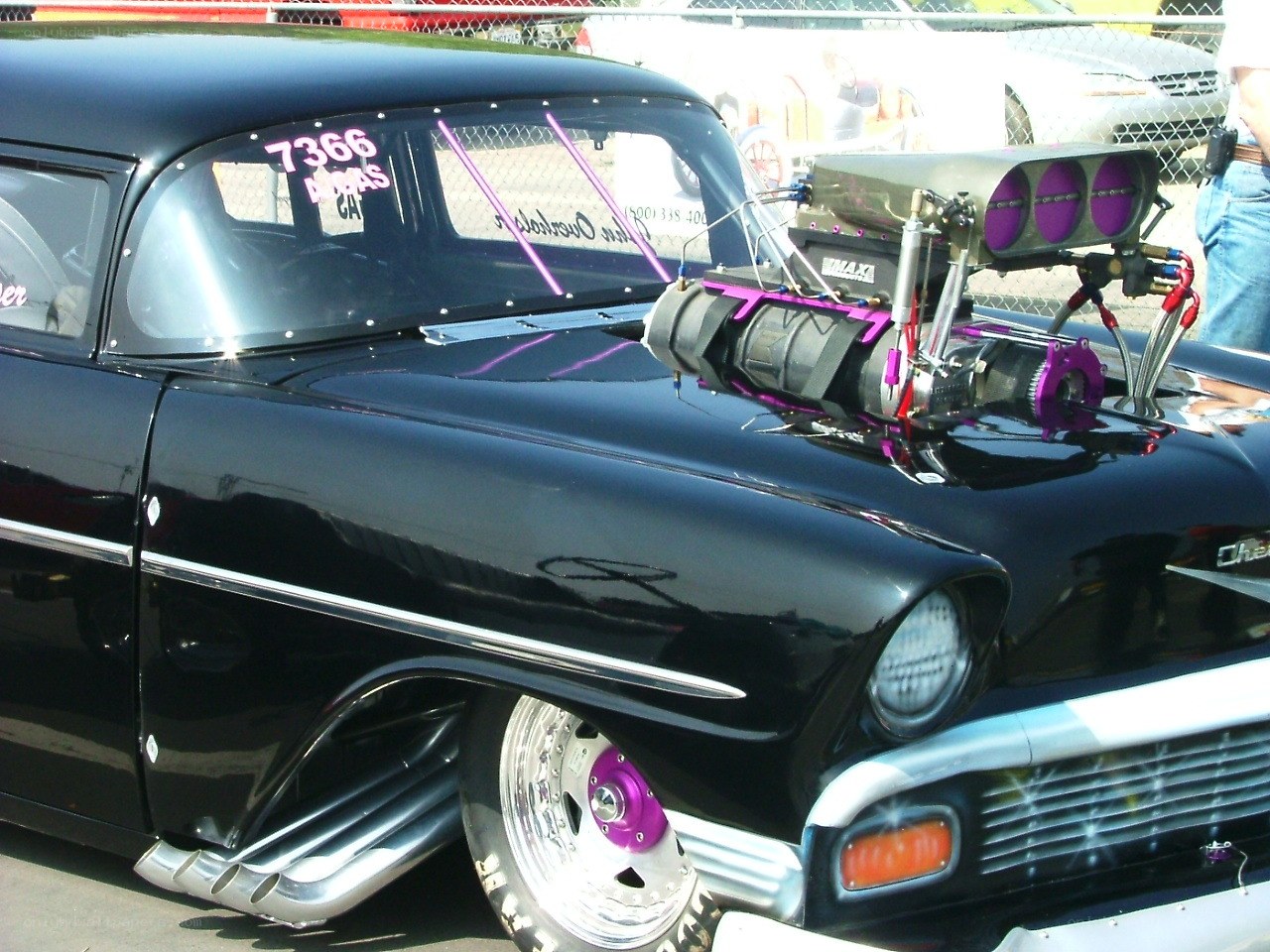 black classic car with supercharger