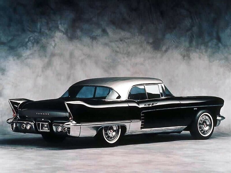 Black classic car with tail fins