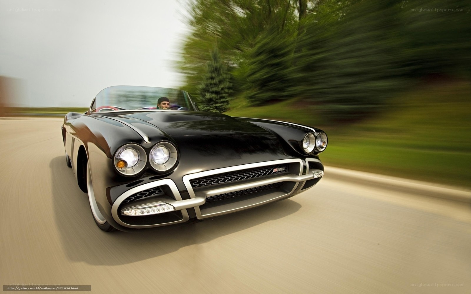 Black classic convertible in motion