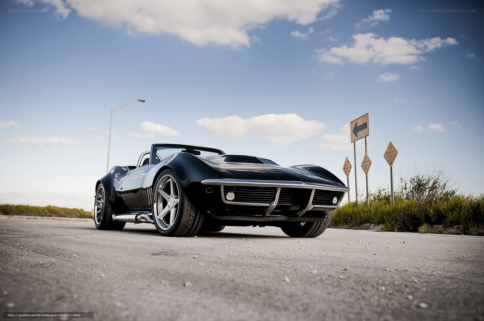 Black classic convertible on road