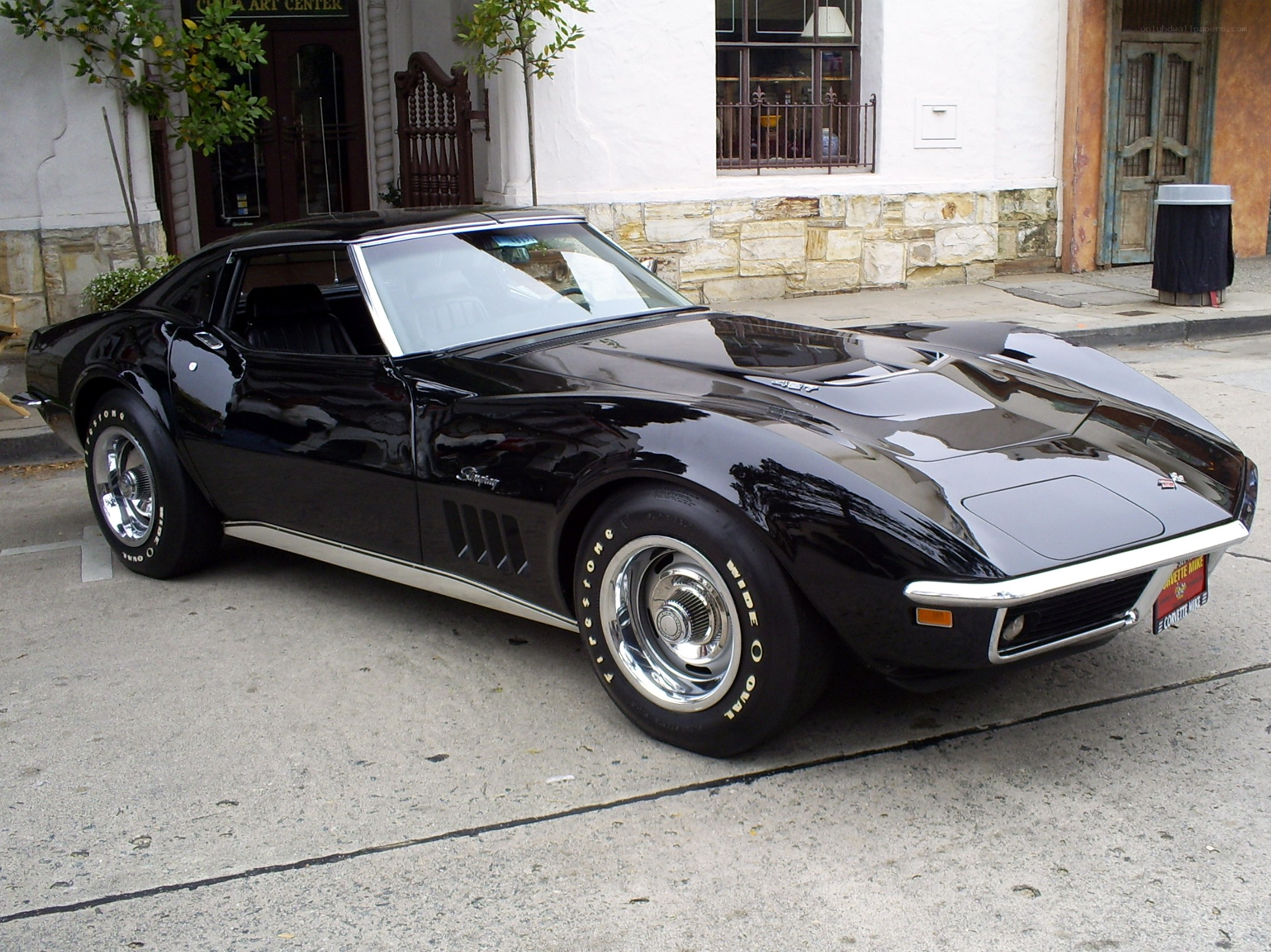 Black classic Corvette parked