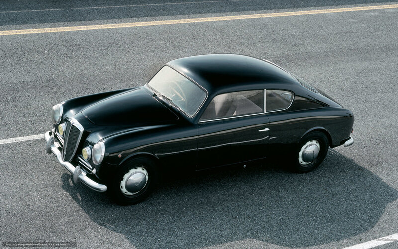 Black classic coupe on asphalt