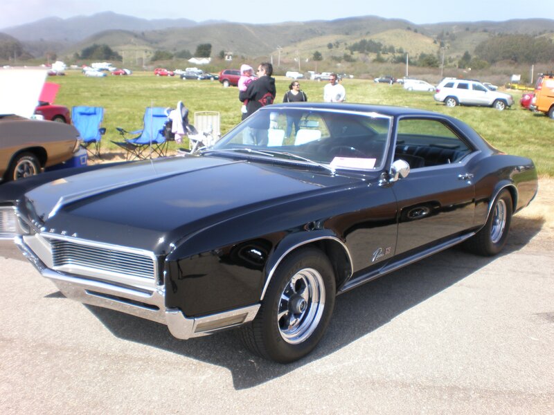 Black classic muscle car at show