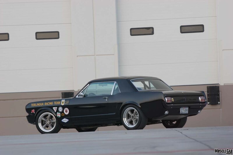 Black Classic Muscle Car — Calm, Afternoon, Photograph, Building, Garage Doors