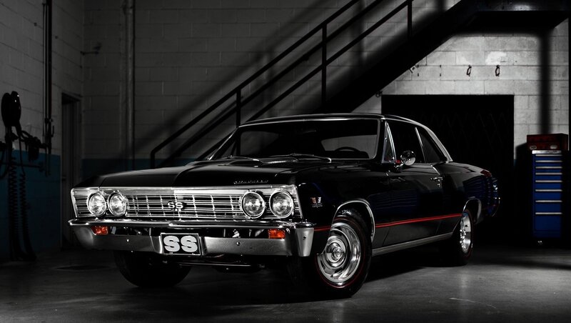Black classic muscle car in garage