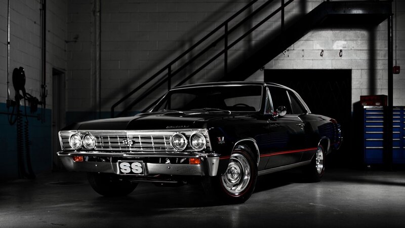 Black classic muscle car in garage