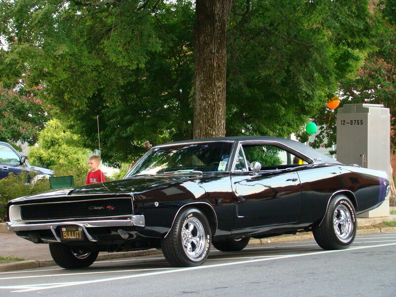 Black classic muscle car on street