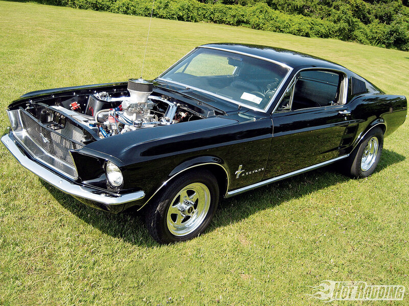 Black classic Mustang on grass