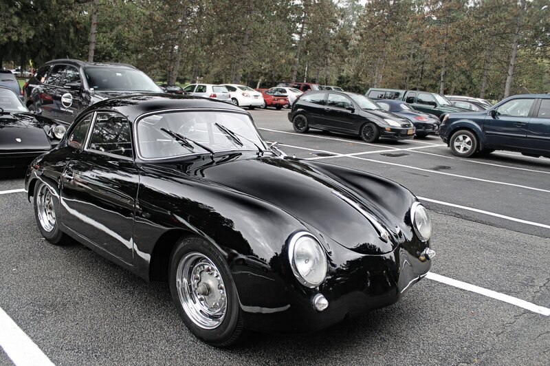 Black classic Porsche in parking lot