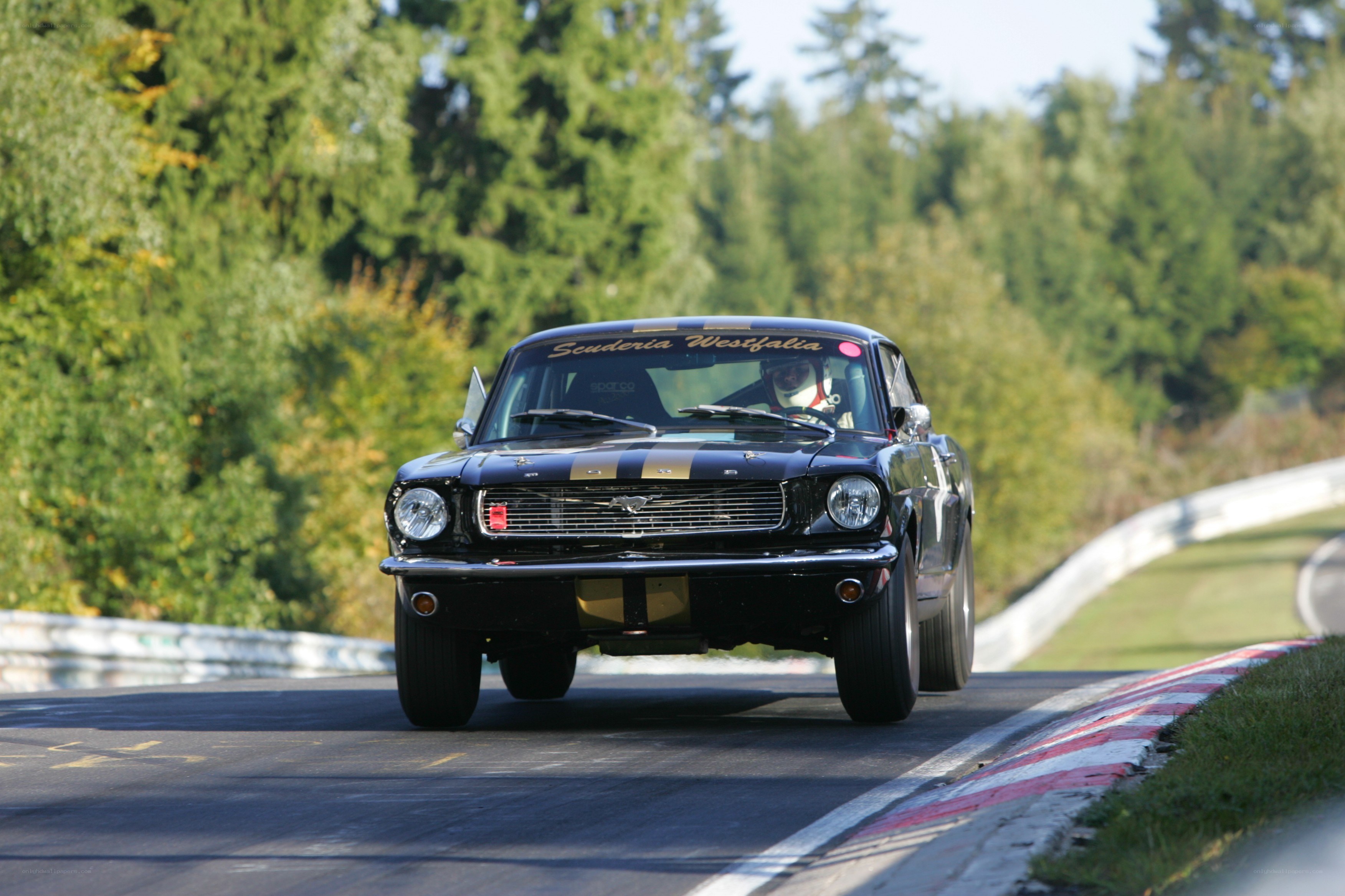 Black classic race car on track