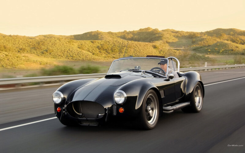 Black classic sports car on road
