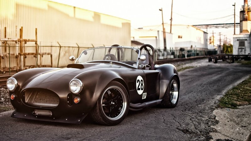 Black classic sports car on road