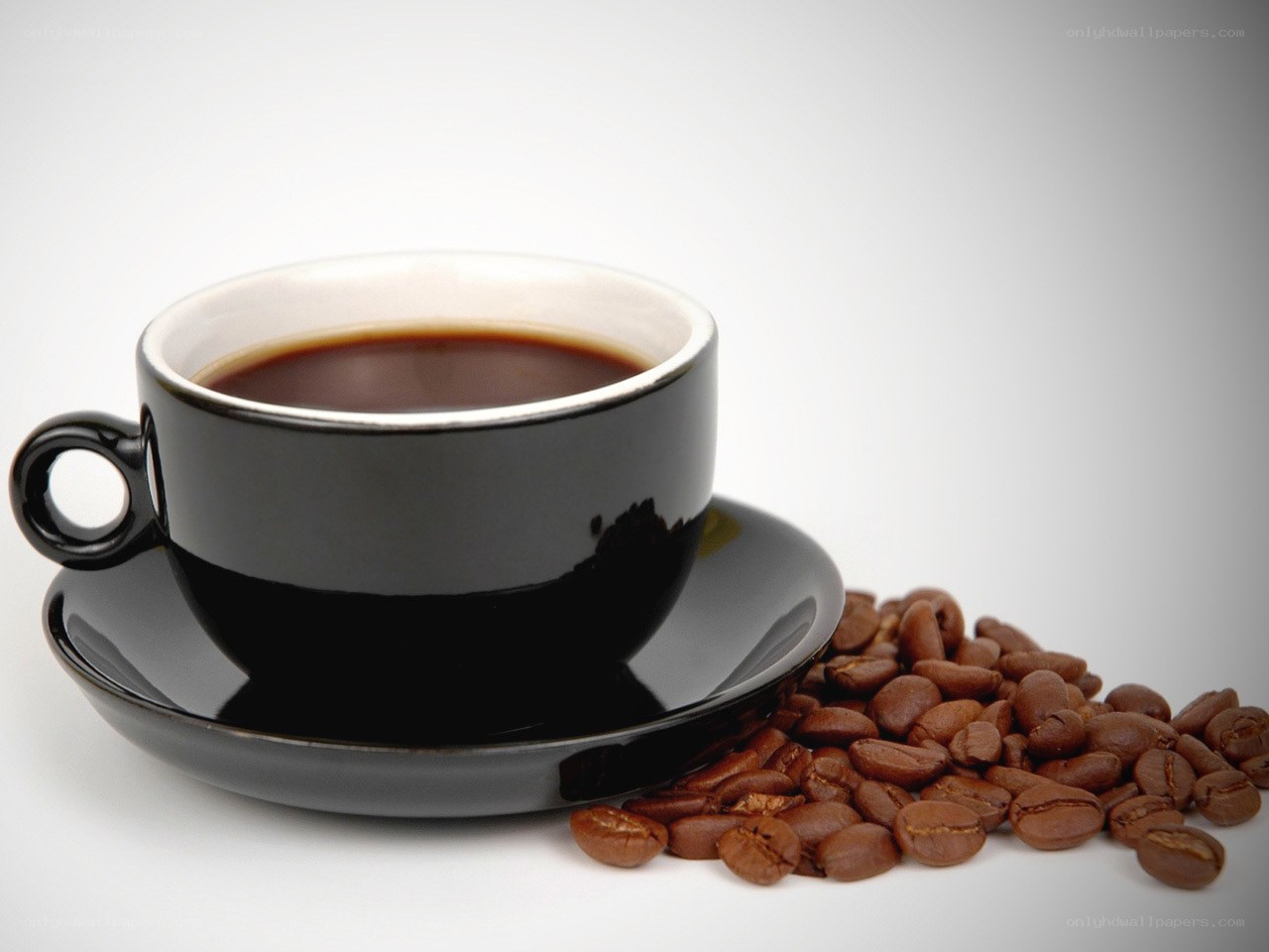 black coffee cup with beans