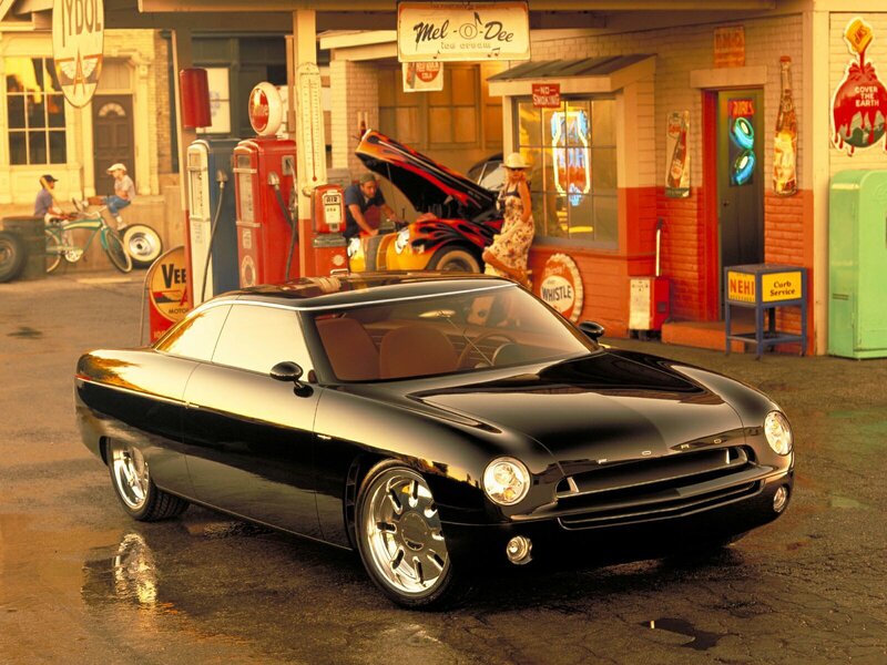 Black concept car at gas station