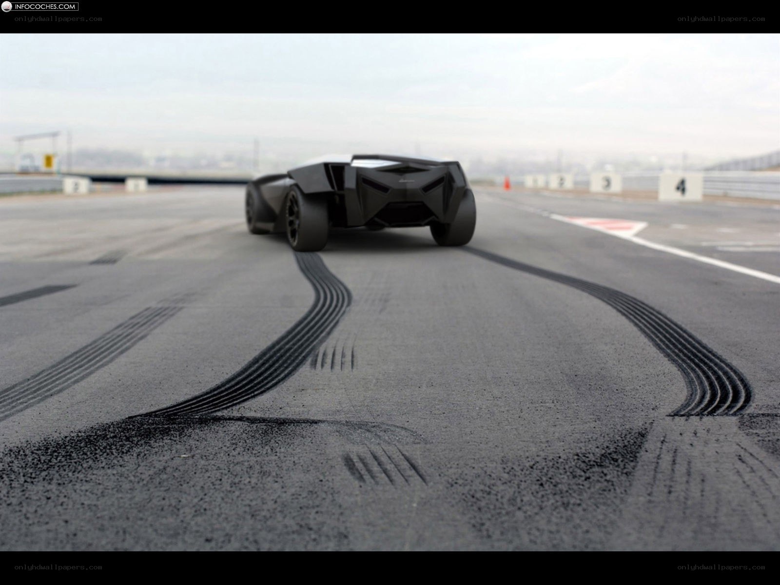 Black concept car on racetrack