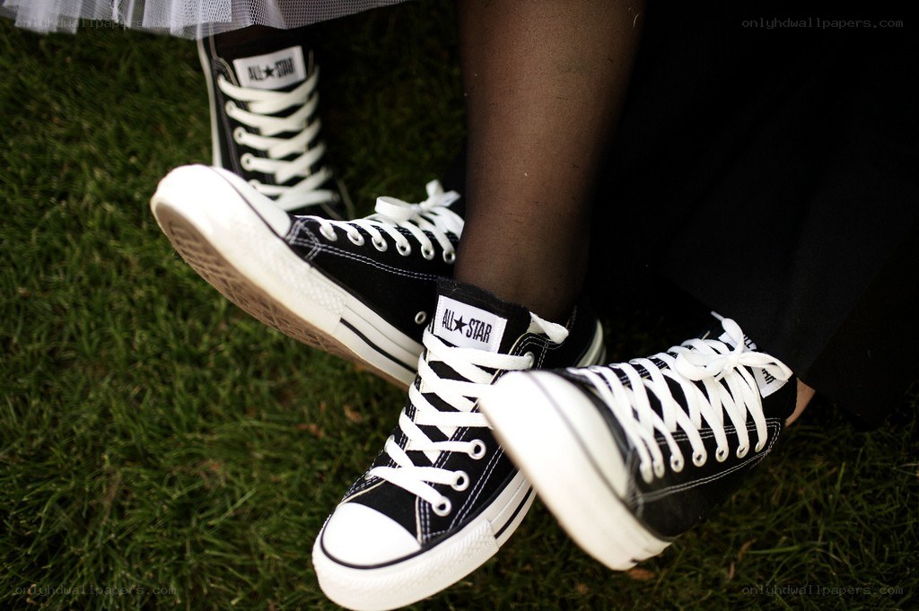 black converse sneakers on grass