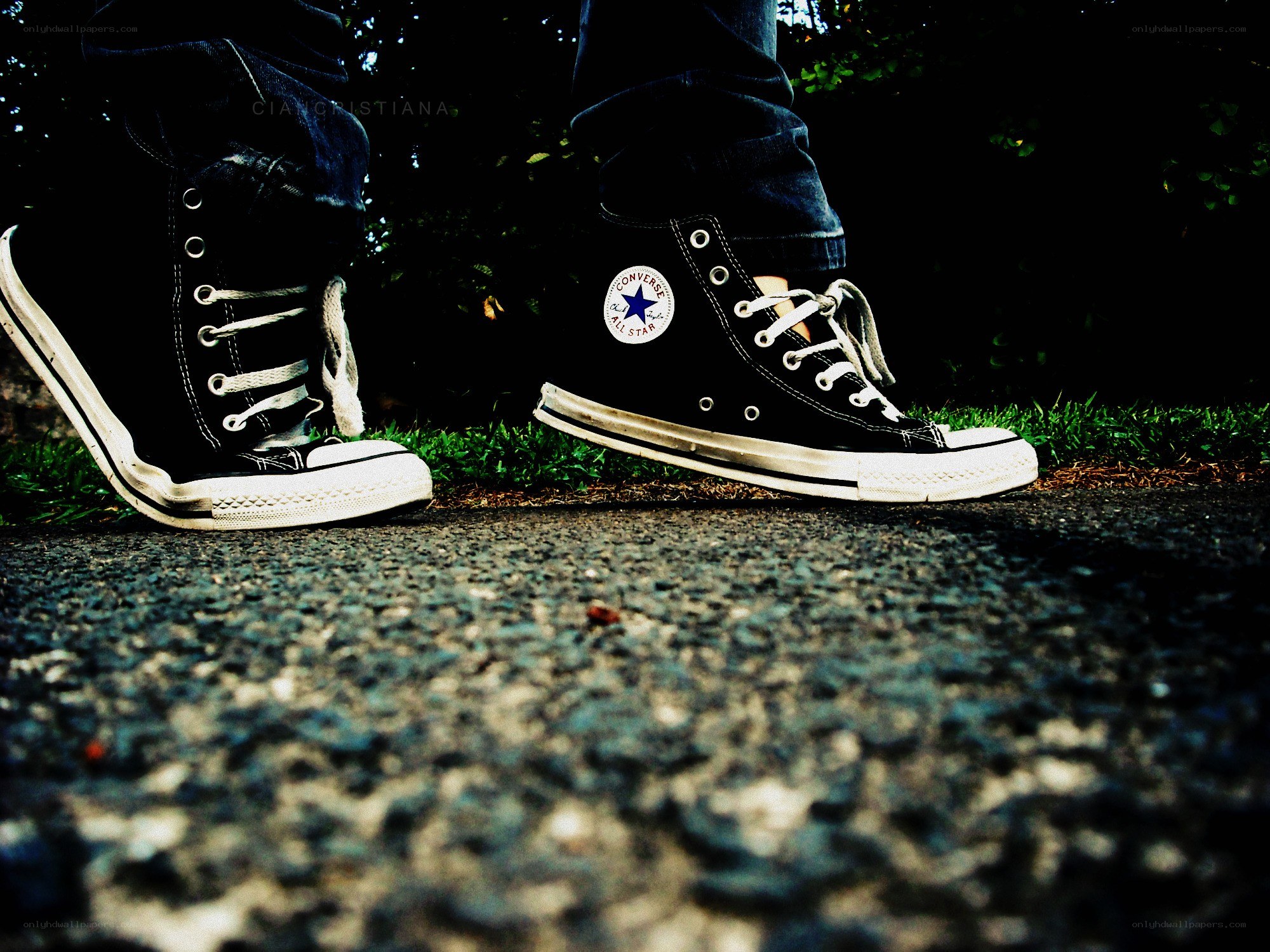 black converse sneakers on pavement