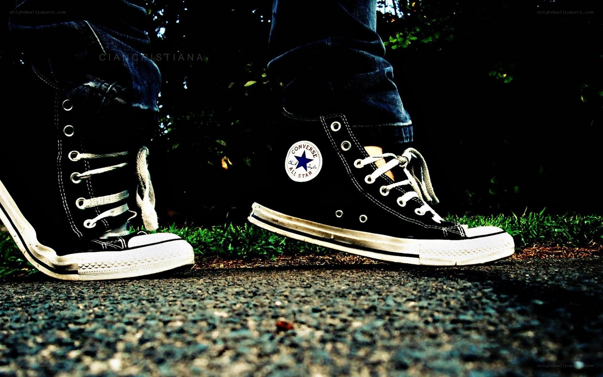 black converse sneakers on pavement