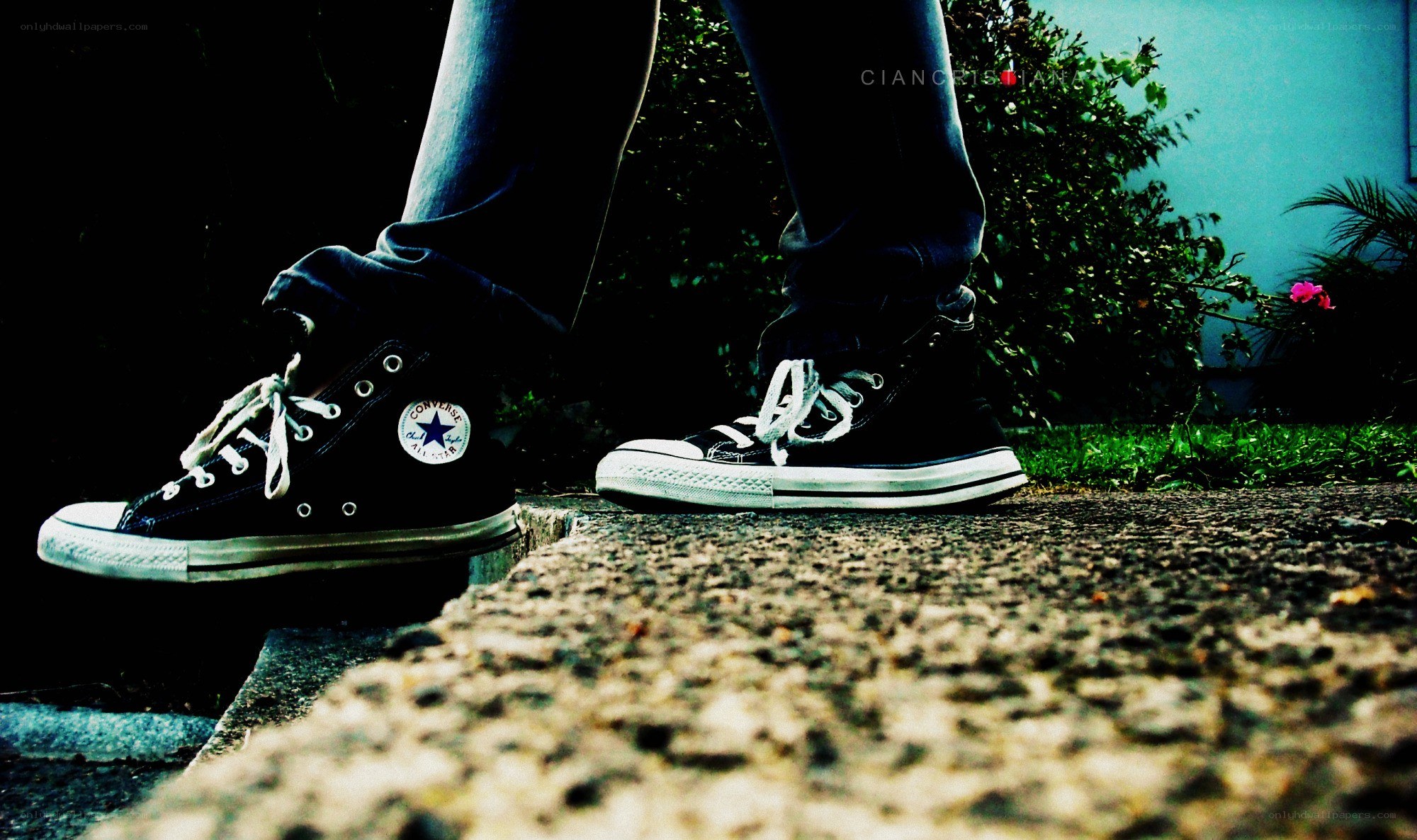 black converse sneakers on pavement