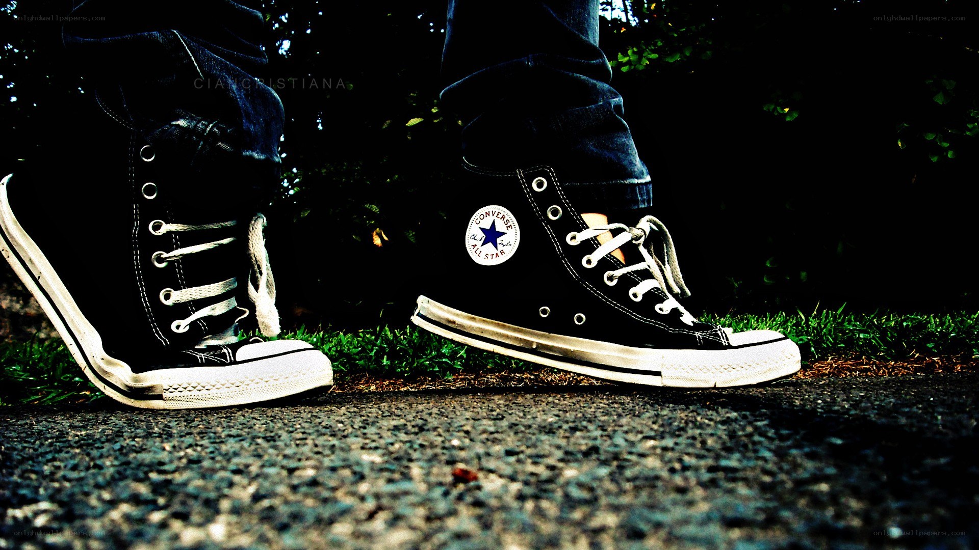 black converse sneakers on pavement
