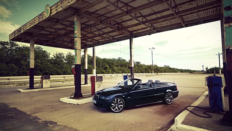 Black convertible at gas station