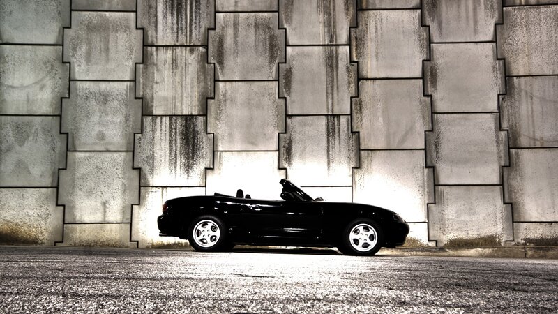 Black convertible car at night