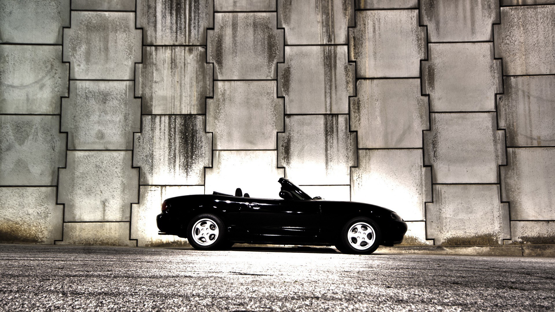 Black convertible car at night