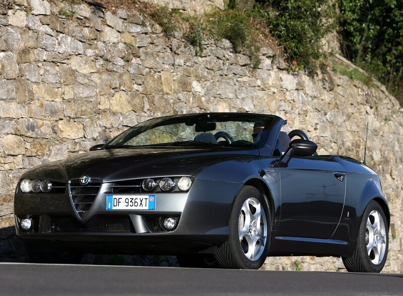 Black Convertible Car — Calm, Afternoon, Photograph, Stone Wall, Road