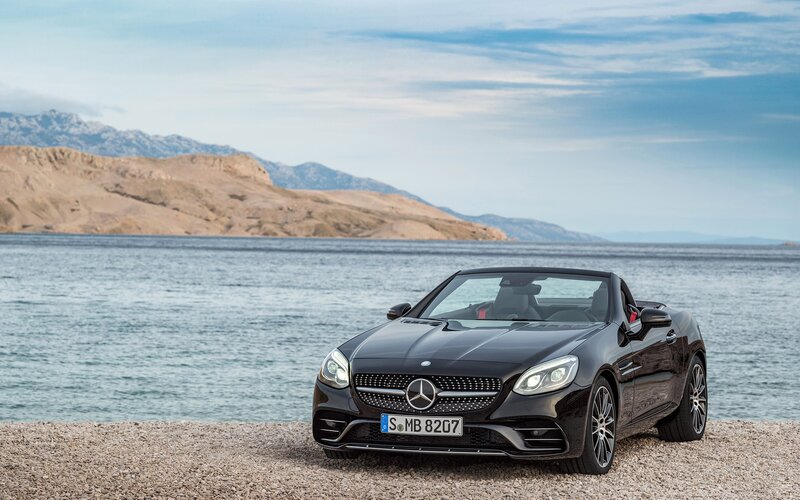 Black Convertible Car — Serene, Afternoon, Photograph, Sea, Mountains