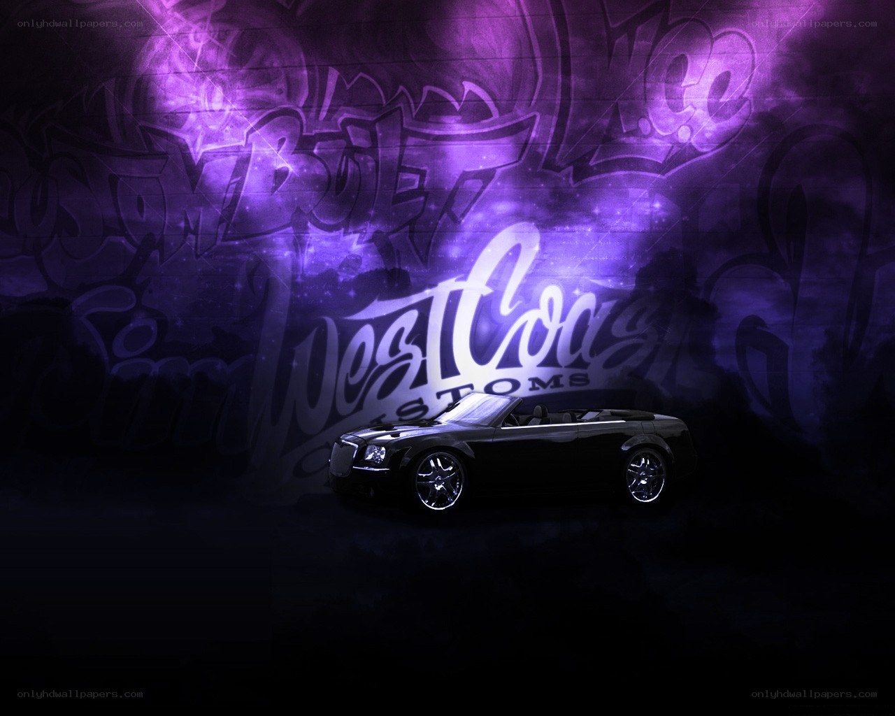 Black convertible car with graffiti