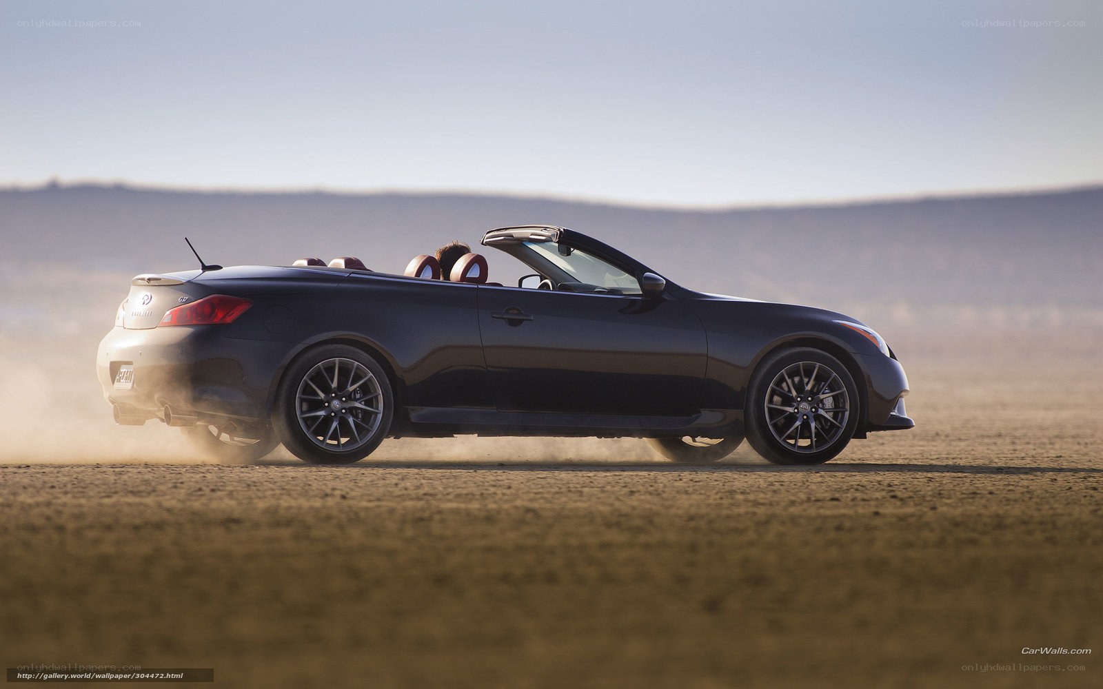 black convertible driving on dirt
