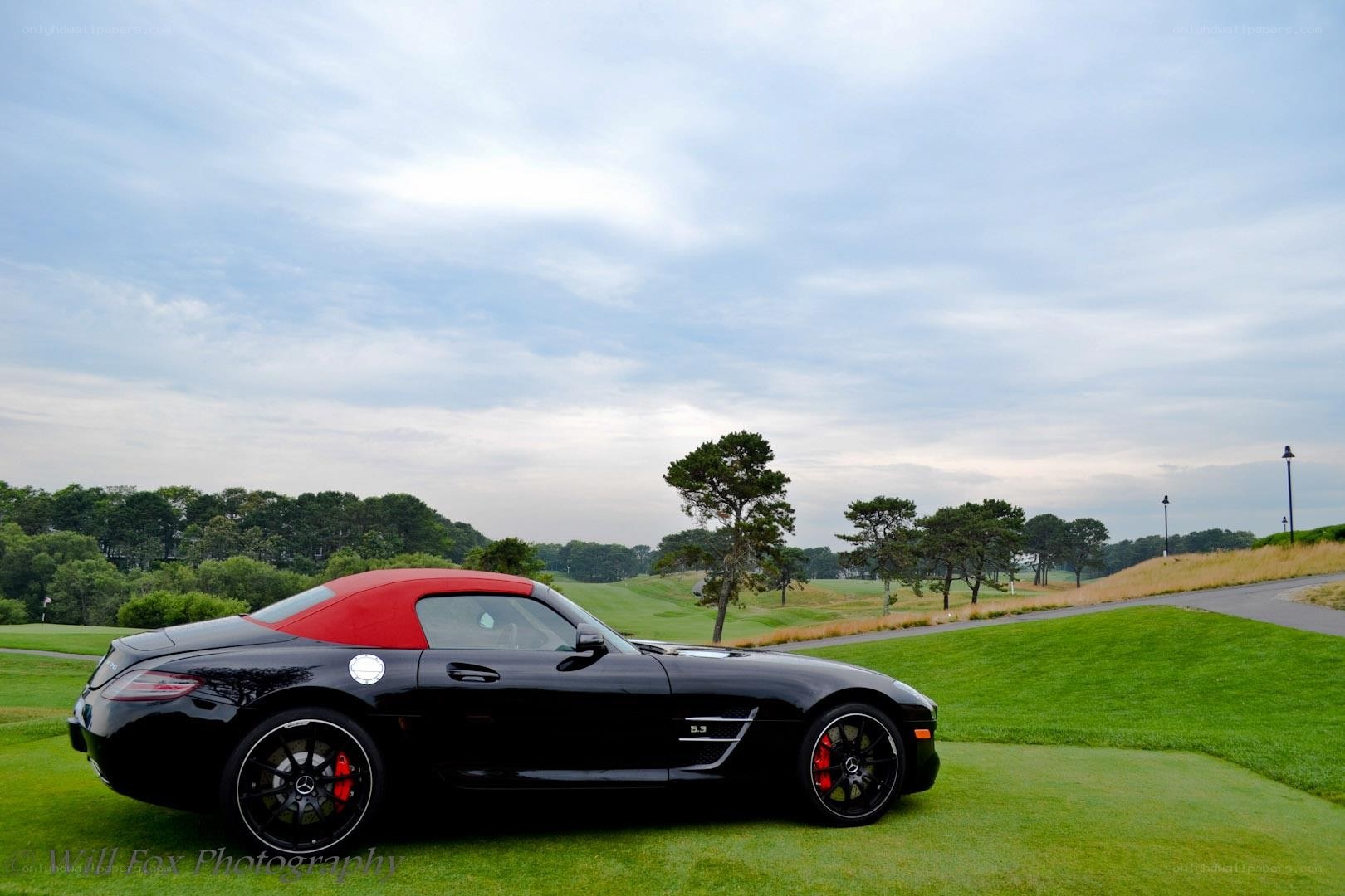 Black convertible on a golf course