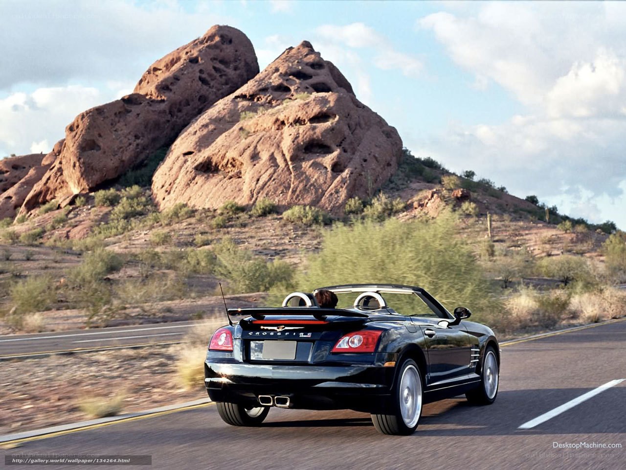 Black convertible on desert road