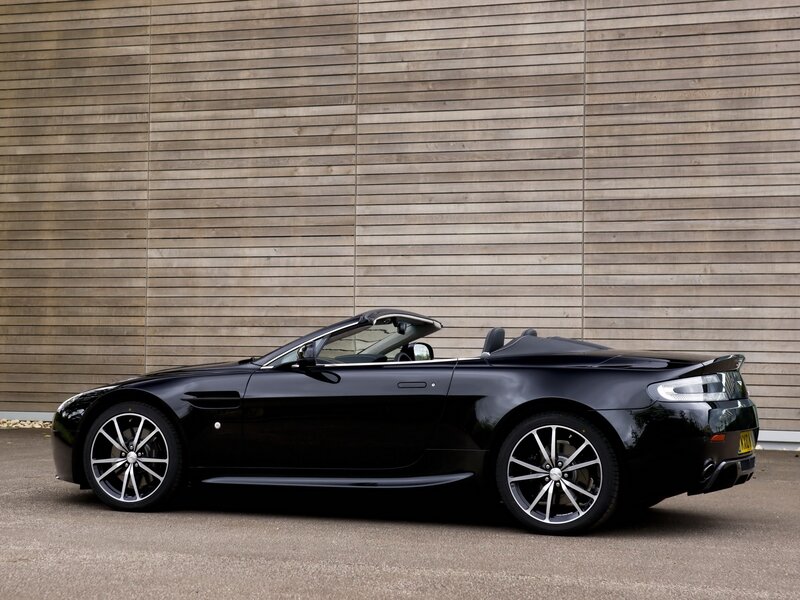 Black Convertible Sports Car — Calm, Afternoon, Photograph, Wooden Wall