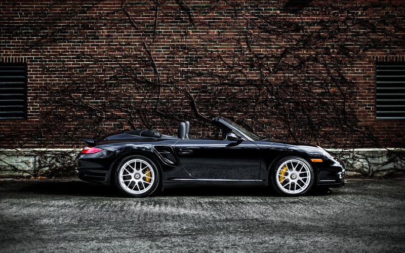 Black Convertible Sports Car — Dramatic, Photograph, Brick Wall