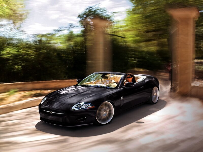 Black convertible sports car in motion