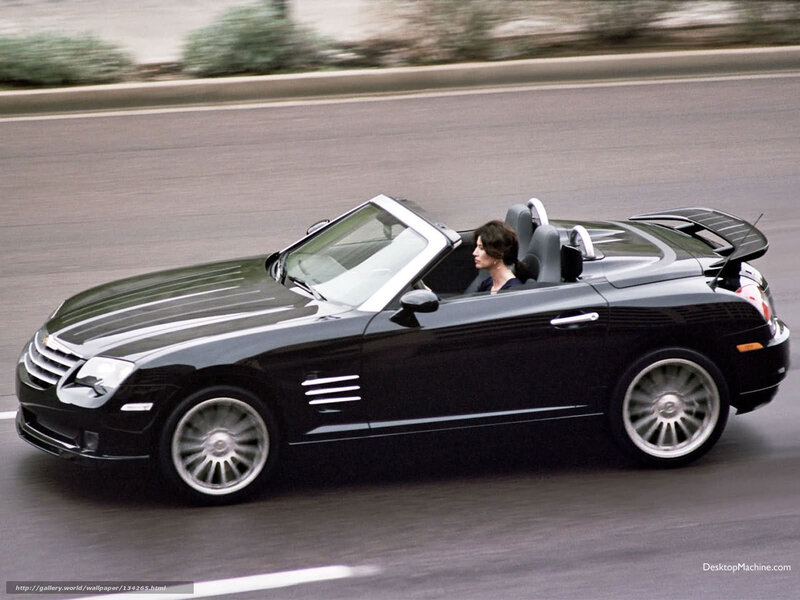 Black convertible sports car in motion
