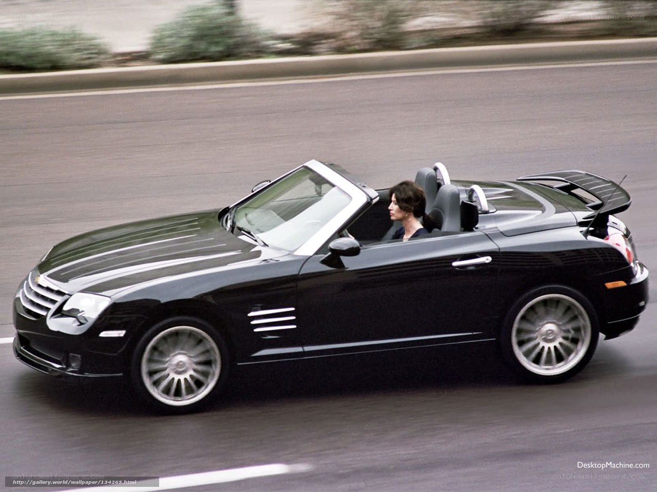 Black convertible sports car in motion