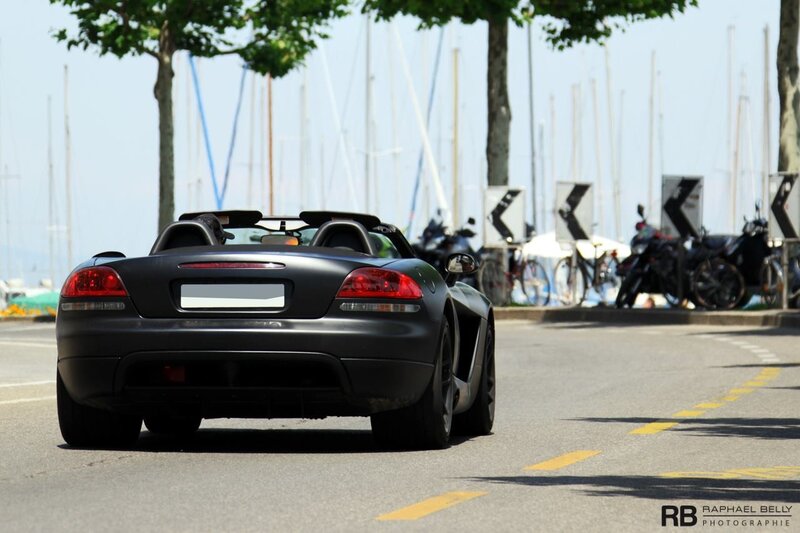 Black convertible sports car on a road