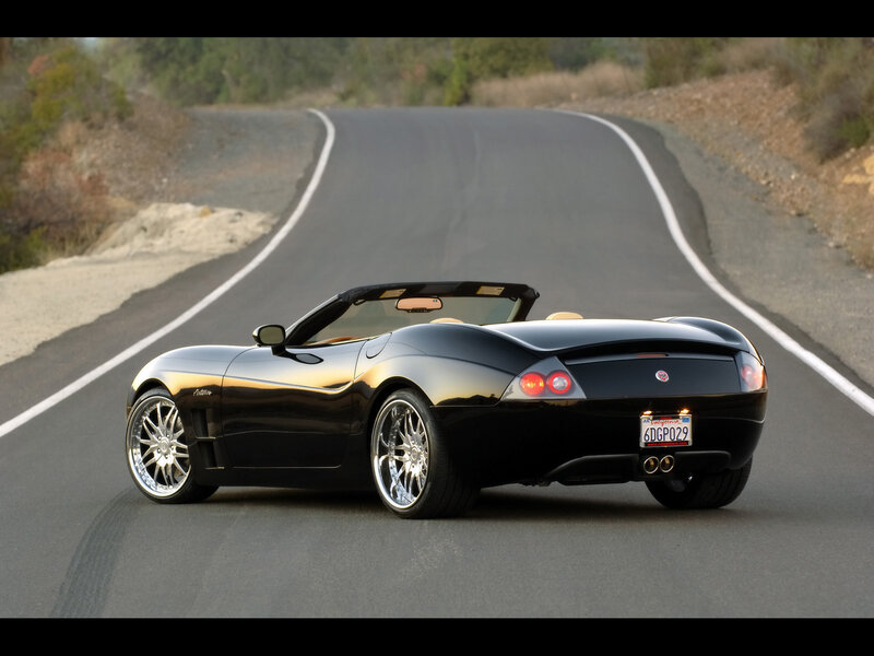 Black convertible sports car on road