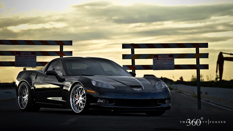 Black Corvette at construction site