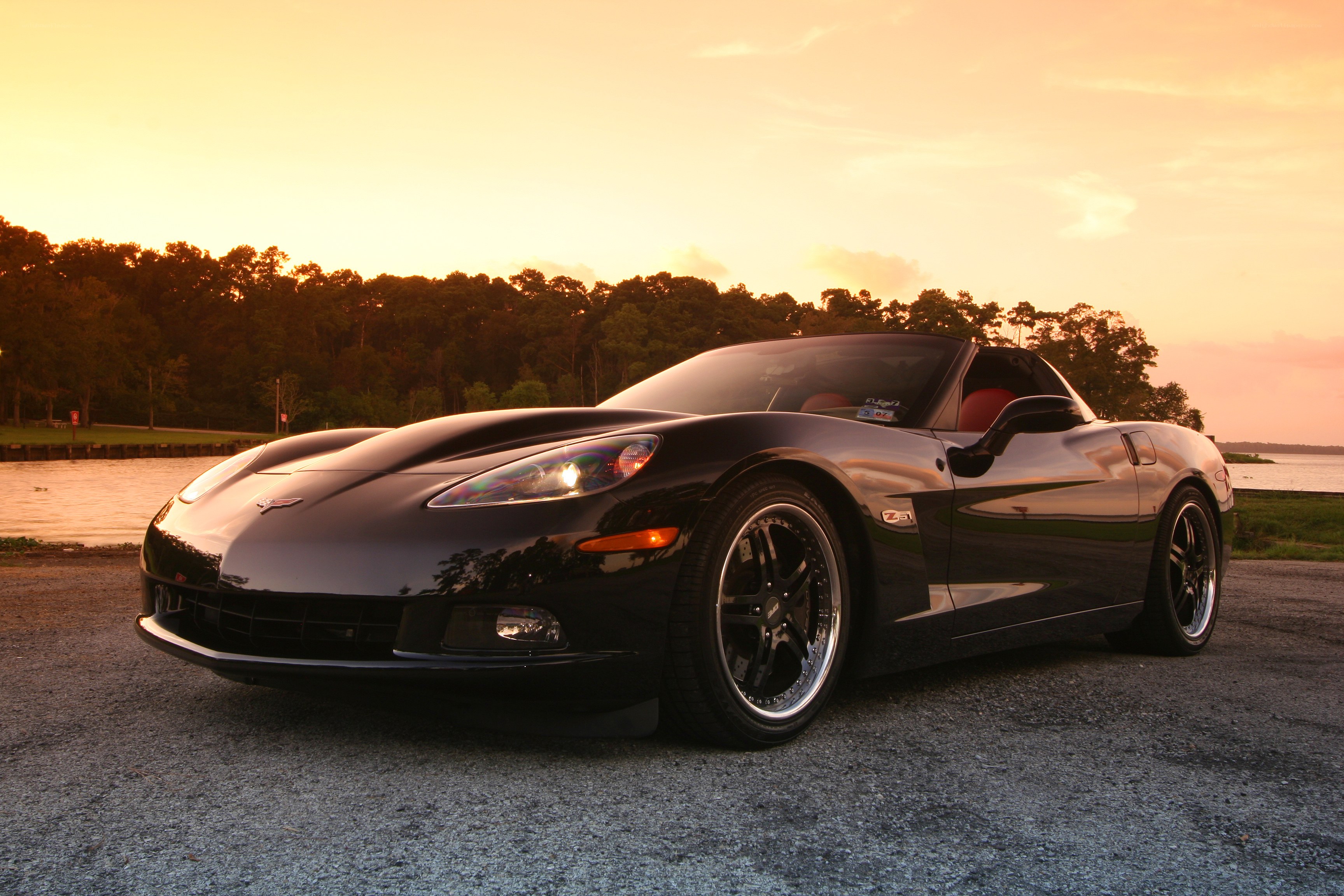 Black Corvette at sunset