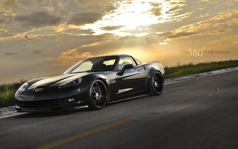 Black Corvette at sunset